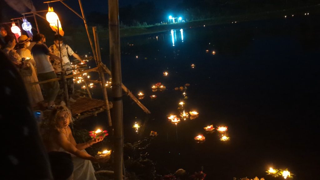 Releasing Loy Krathong to river