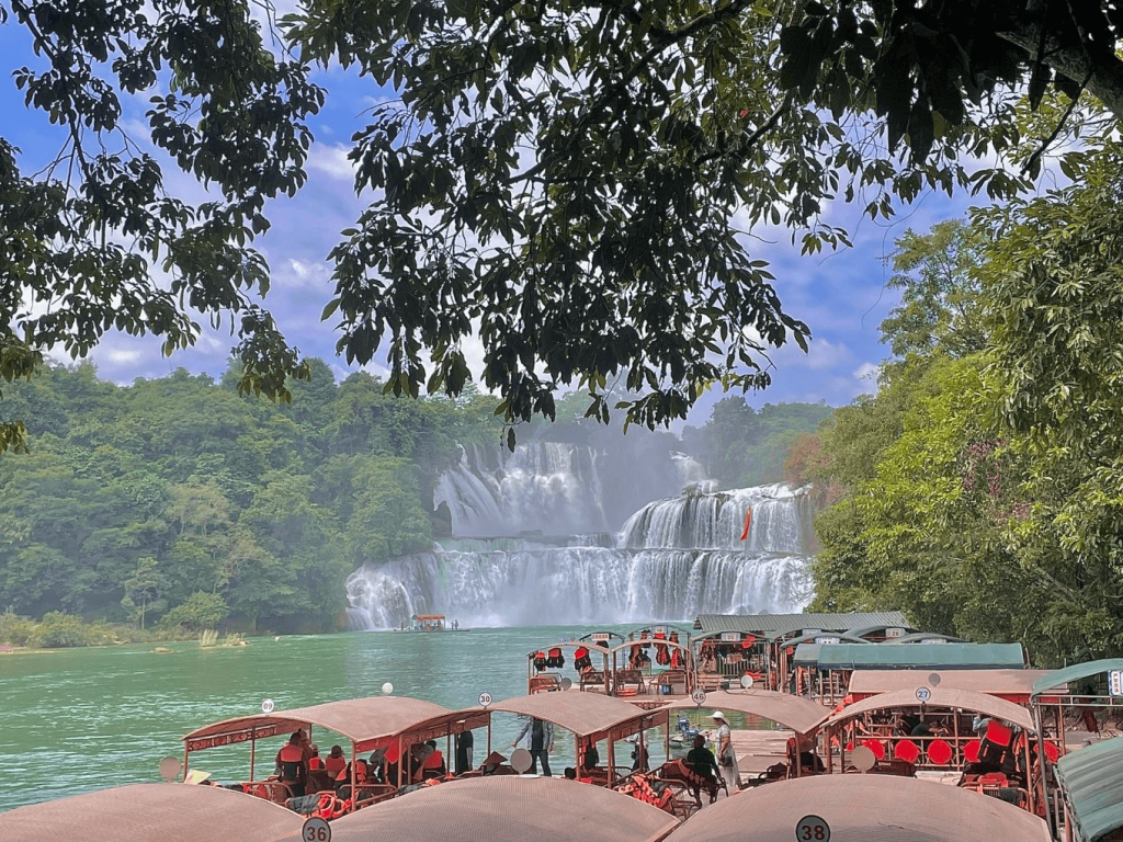 many boats in front of detian waterfall