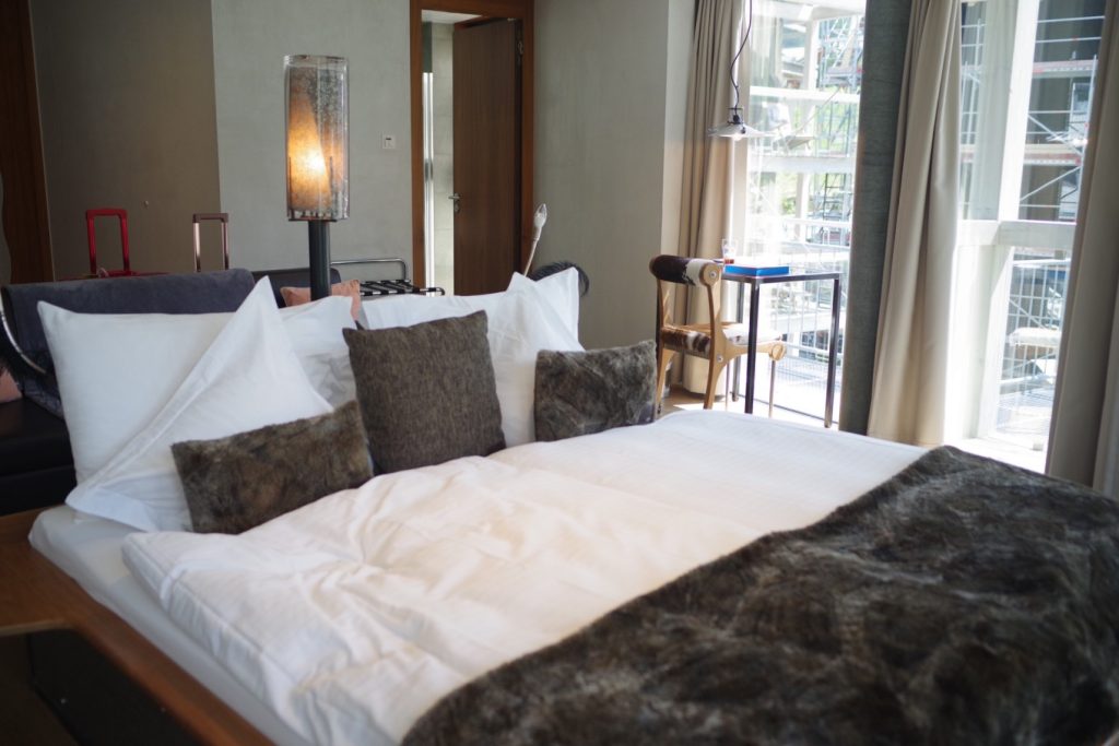 Matterhorn FOCUS Design Hotel Review: Modern Retreat at the Foot of the Alps 8 Deluxe Mountain View Room - king sized bed