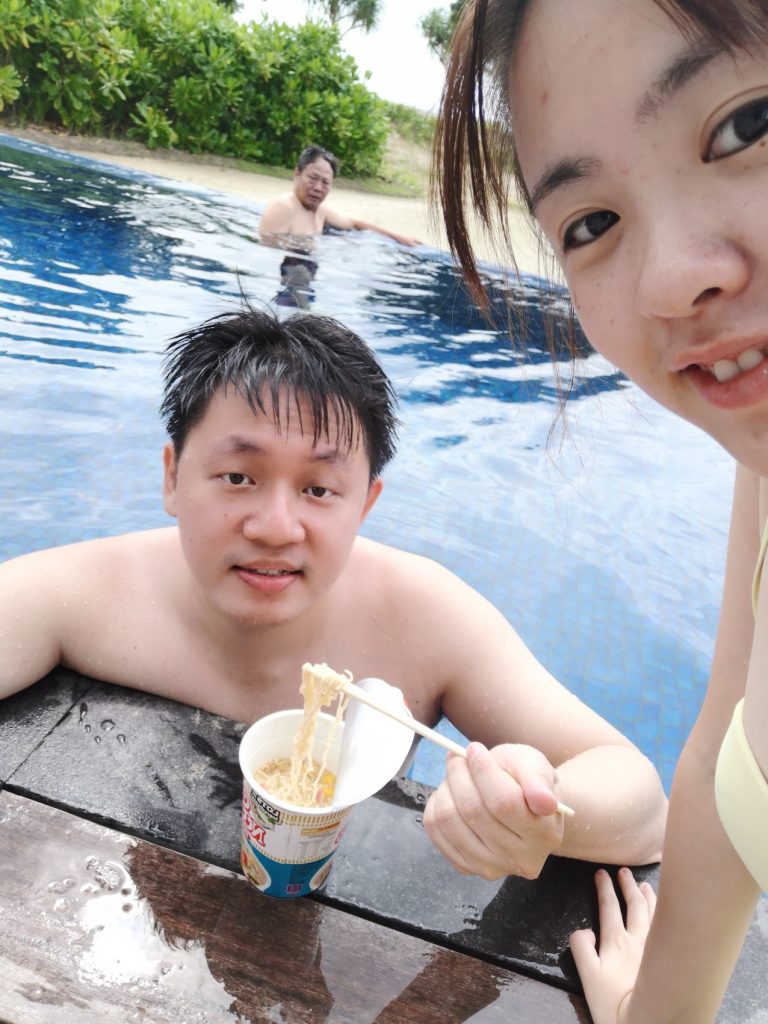 The Residence Bintan Review – Luxury Beachfront Villa Stay 9 derek having cup noodles while dipping in private pool