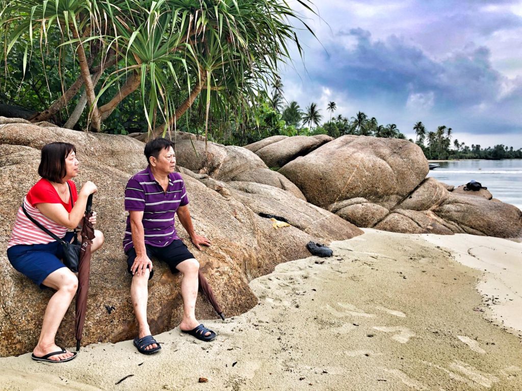 The Residence Bintan Review – Luxury Beachfront Villa Stay 13 mum and dad in beach in the residence bintan