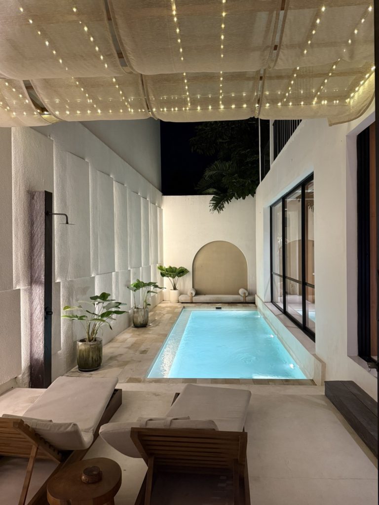 Villa Tiiiga Thrē’s interior pool at night