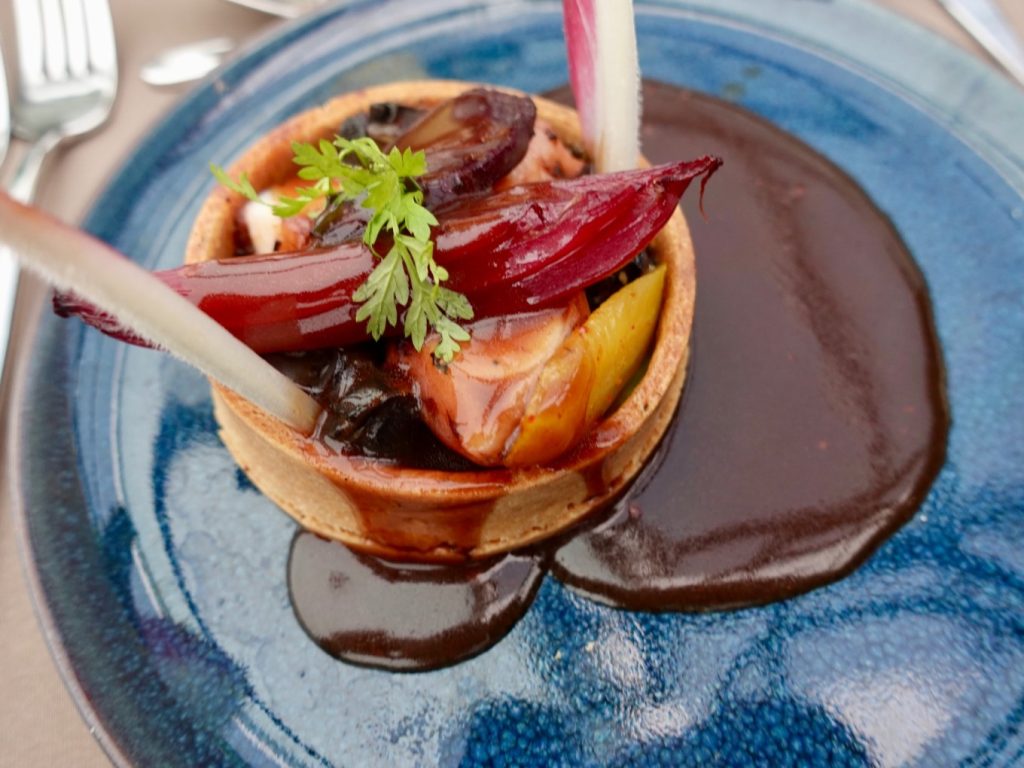 foie gras served with a toasted brioche and a tiny garnish