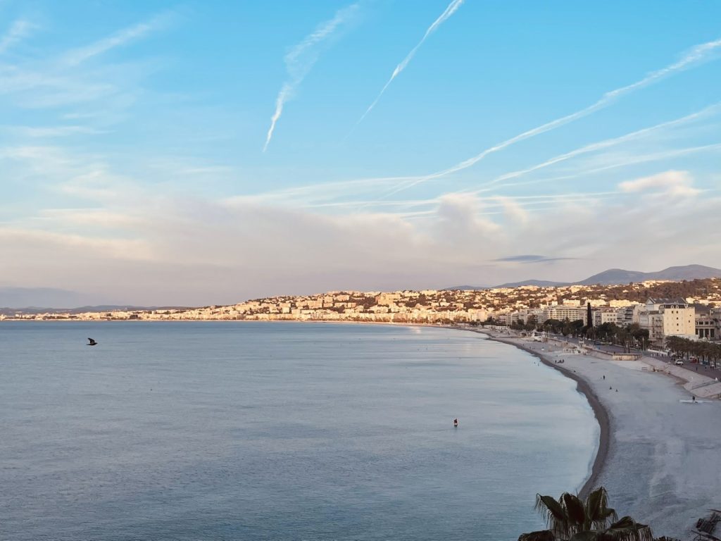 Hotel Suisse Nice Review: Iconic Sea Views on the French Riviera 13 Clear view of turquoise Mediterranean waters from Hôtel Suisse Nice arched balcony.