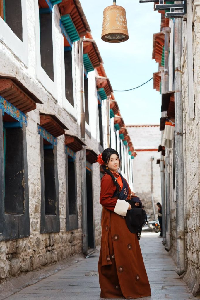 Standing along an old narrow alley near Barkhor Street