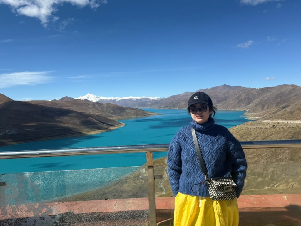 How to Plan a Trip to Tibet? 8 Overlooking the turquoise Yamdrok Lake with snow-capped mountains in the distance