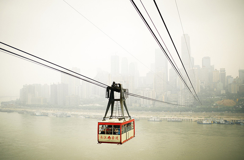 Yangtze River Cableway, Chongqing – Flying Over the Yangtze River 5 Yangtze River Cableway gliding over the Yangtze River with Chongqing skyline in the background.