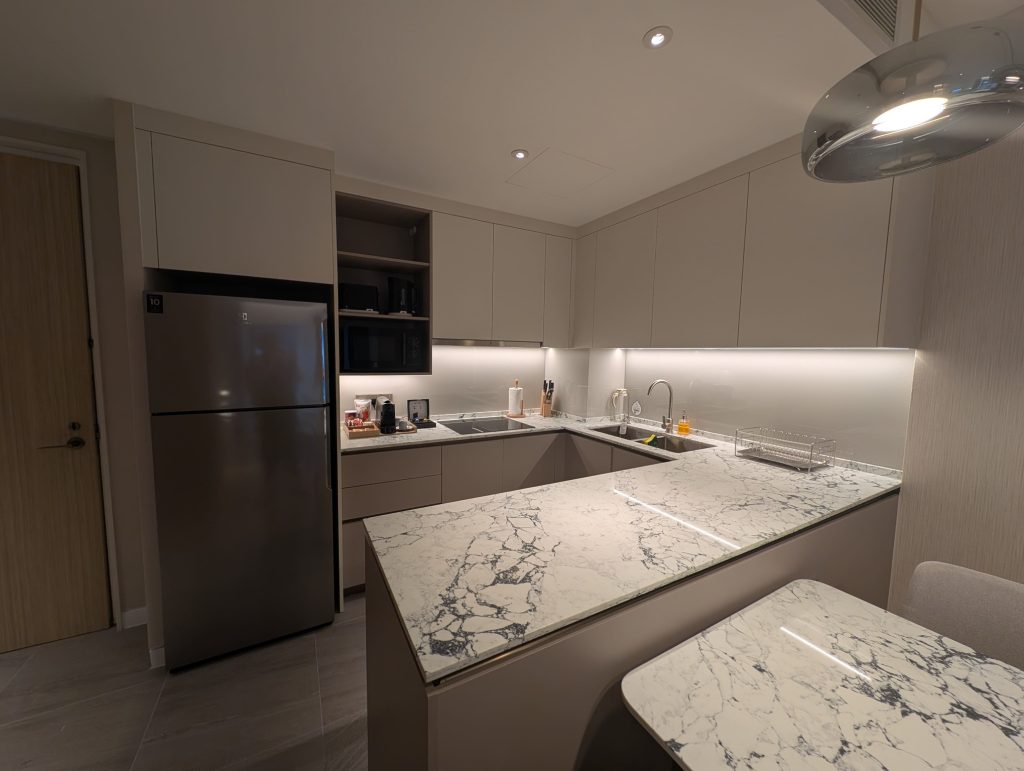 Marriott Executive Apartments Kuala Lumpur Review: Our 2-Night Family Stay 6 Modern serviced apartment kitchen with marble countertop and built-in cabinets at Marriott Executive Apartments Kuala Lumpur.