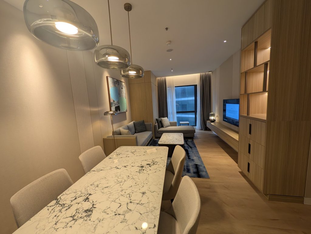 Marriott Executive Apartments Kuala Lumpur Review: Our 2-Night Family Stay 11 Open-concept dining and living area with marble dining table and pendant lights at Marriott Executive Apartments Kuala Lumpur.