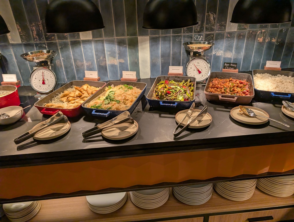 Marriott Executive Apartments Kuala Lumpur Review: Our 2-Night Family Stay 29 Asian breakfast dishes including vegetables, noodles, chicken, and rice at Marriott Executive Apartments Kuala Lumpur.