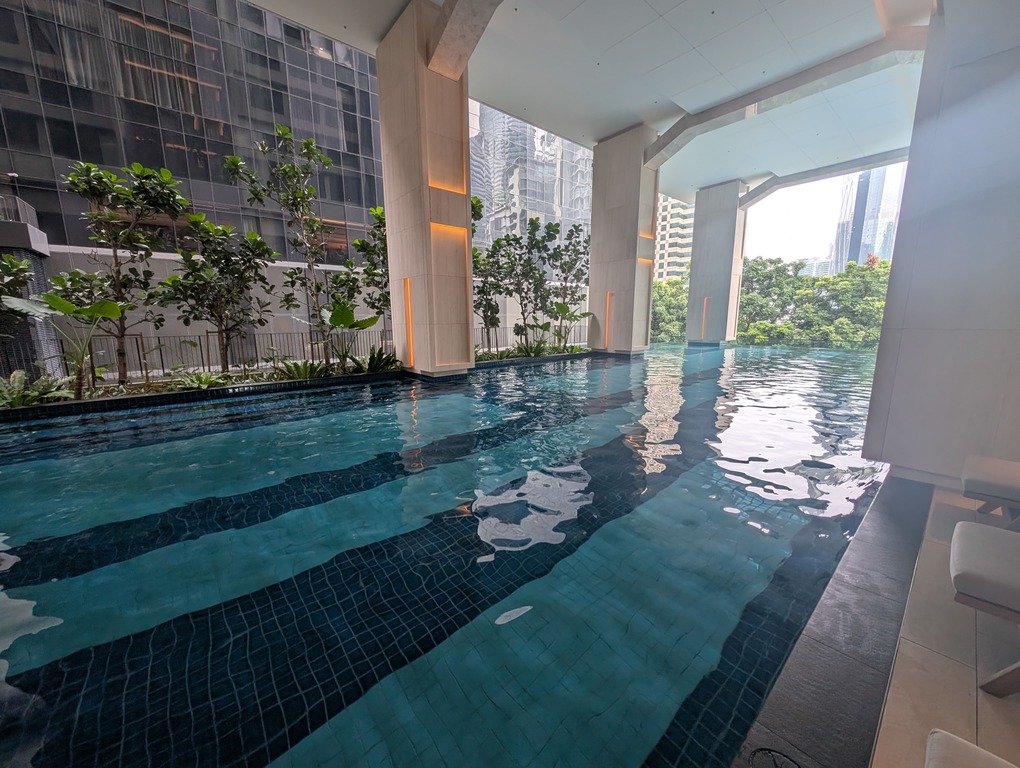 Marriott Executive Apartments Kuala Lumpur Review: Our 2-Night Family Stay 20 Semi-indoor hotel pool with city skyline views at Marriott Executive Apartments Kuala Lumpur.