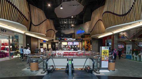 Mid Valley Megamall interior with shoppers walking through wide retail corridors
