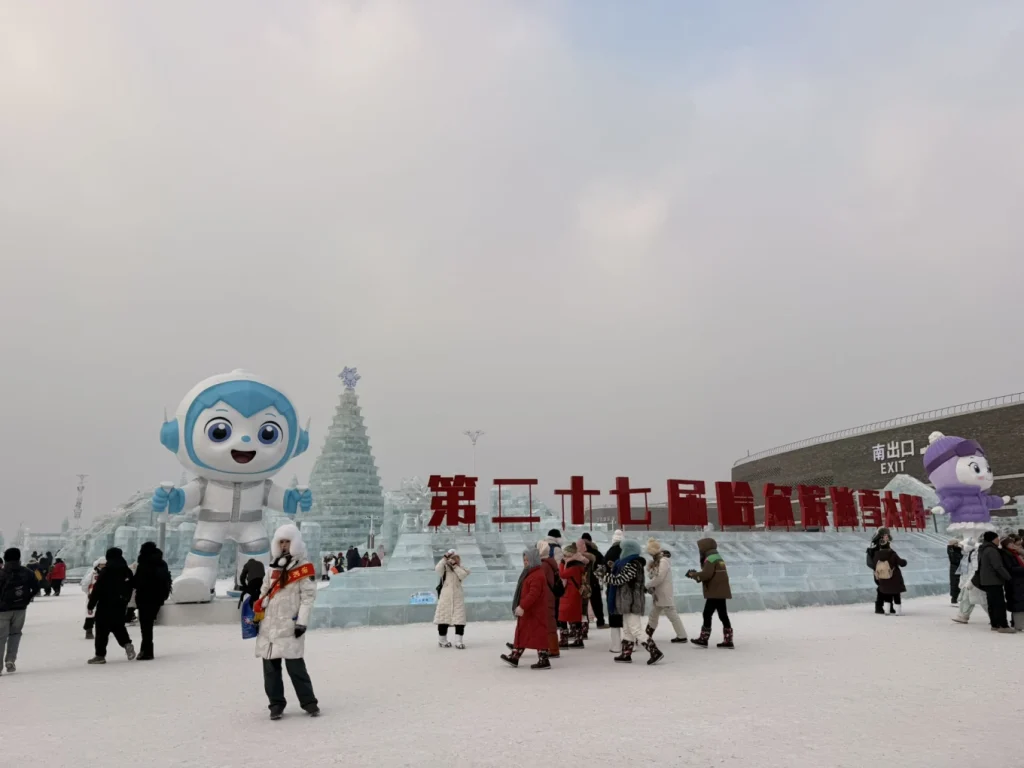 Visit to Harbin Ice and Snow World: What It’s Really Like 5 Entrance area of Harbin Ice and Snow World with ice sculptures and winter crowds