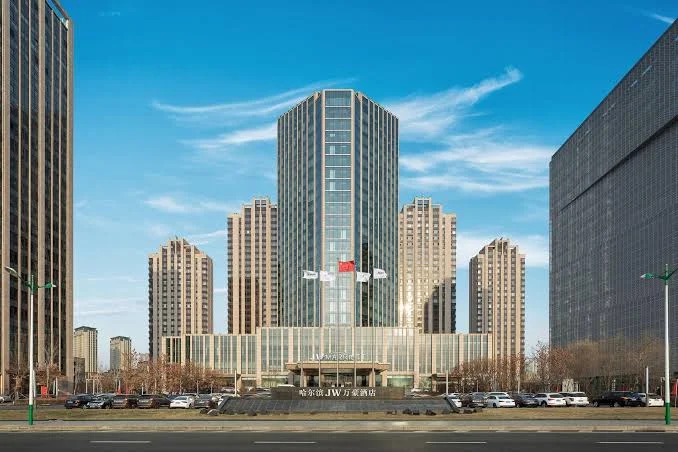 JW Marriott Hotel Harbin River North exterior in Songbei District beneath a clear blue sky