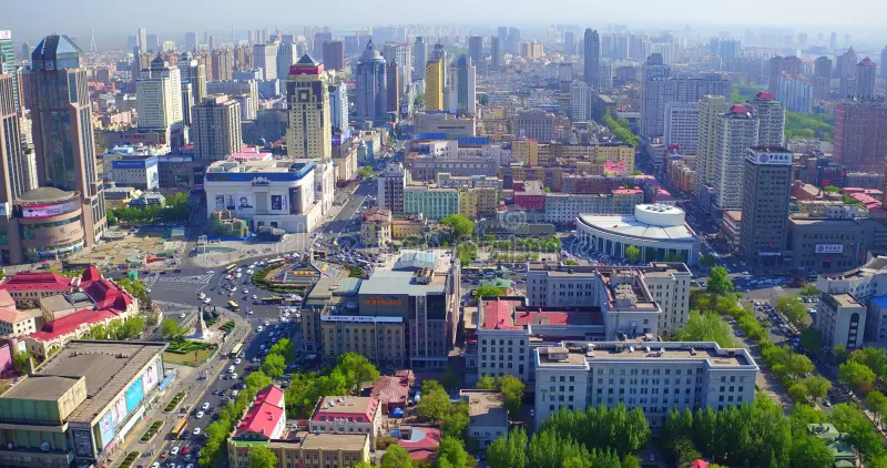Where to Stay in Harbin: Best Areas & Hotels for Winter Travel 9 Aerial view of Nangang District in Harbin with city center buildings and main roads