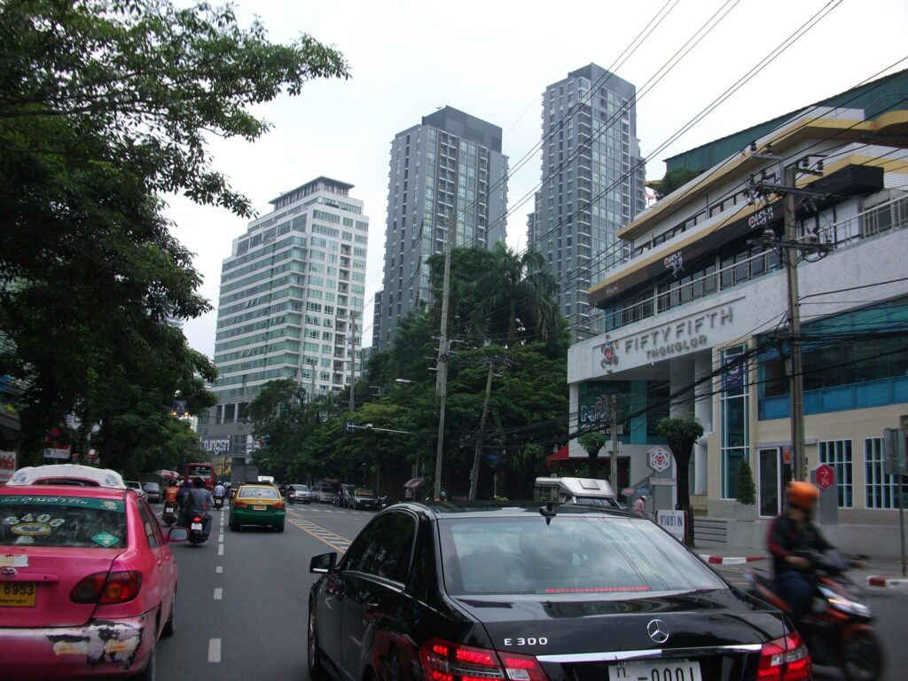 Where to Stay in Sukhumvit Bangkok: Best Areas, Hotels & Travel Tips 9 Thong Lo street in Sukhumvit with modern buildings, shops, and city traffic during daytime