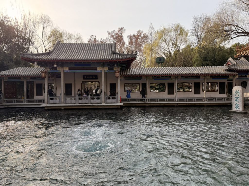 Baotu Spring Travel Guide: Visiting Jinan’s No.1 Spring 5 Covered walkway along Baotu Spring with flowing water and traditional buildings