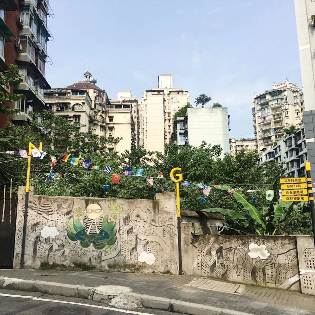 Beicang Creative Cultural District in Chongqing Near Guanyinqiao 9 Street art wall at Beicang Creative Cultural District with residential buildings in the background