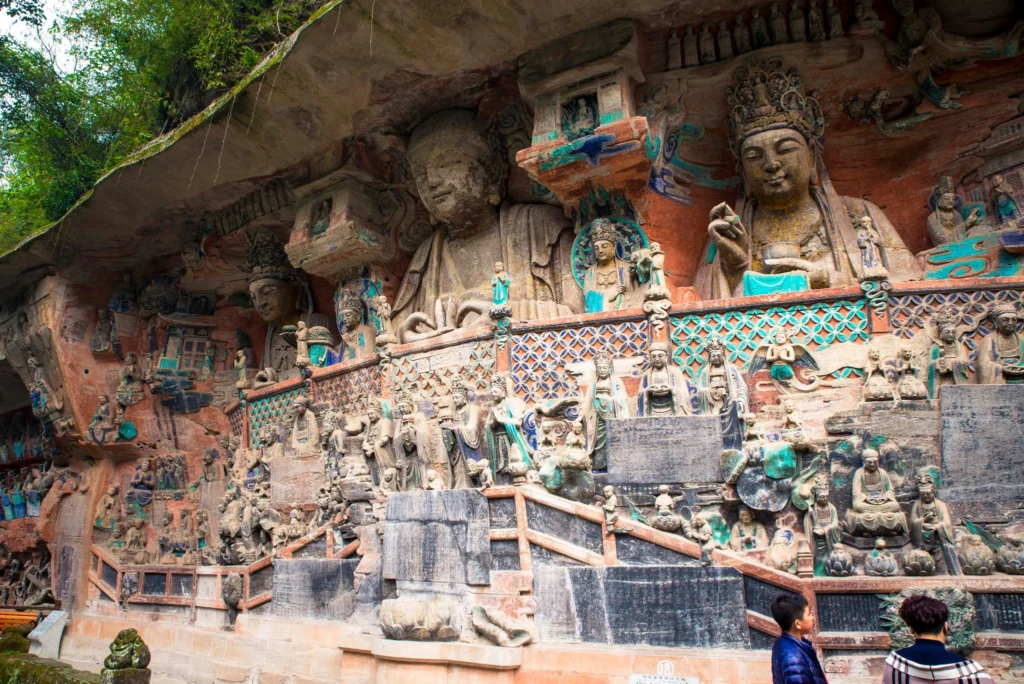 Dazu Rock Carvings Chongqing: Complete Guide to the UNESCO Buddhist Site 7 Large cliffside Buddhist statues and colorful relief carvings at Baodingshan in the Dazu Rock Carvings, Chongqing.