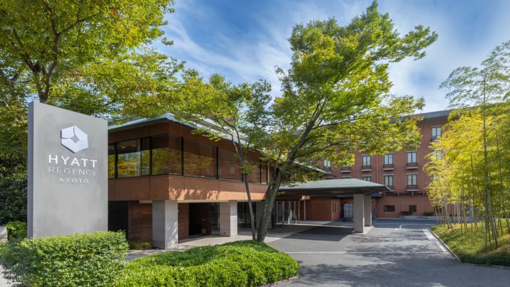10 Best Muslim-Friendly Hotels (Halal) In Kyoto 13 Hyatt Regency Kyoto entrance with modern brick exterior, bamboo landscaping, and tree-lined driveway in Higashiyama.