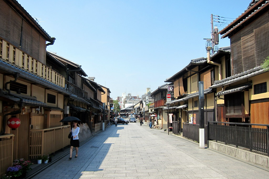 Traditional wooden machiya houses lining a quiet street in Gion, Kyoto’s historic geisha district