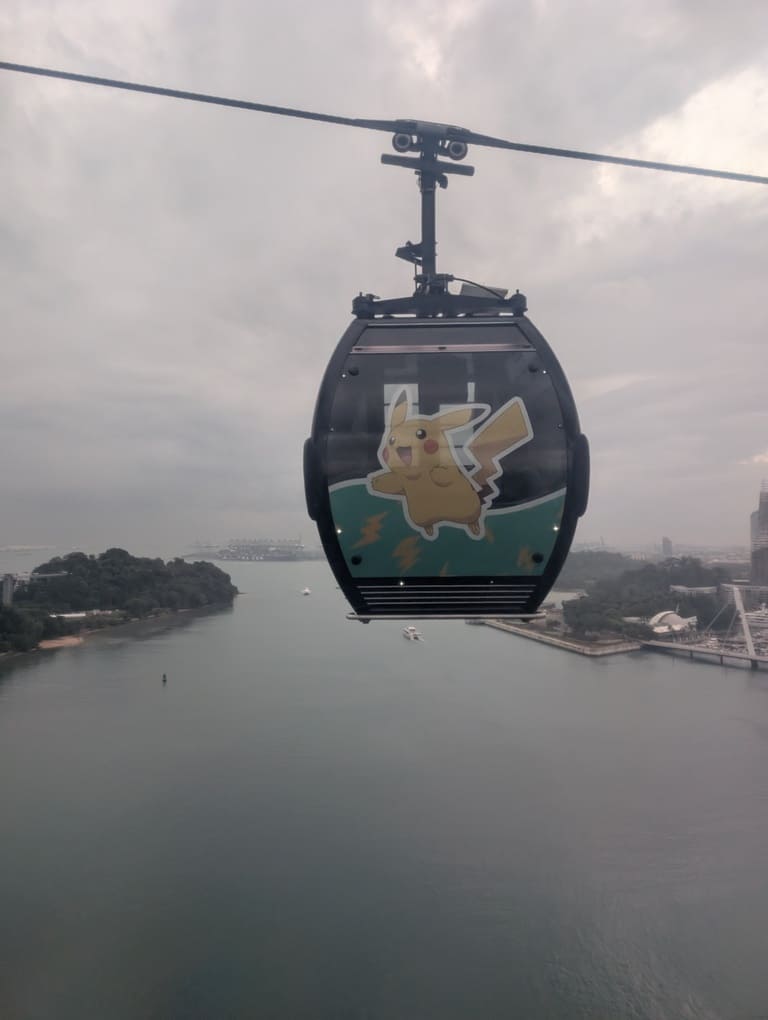 Mount Faber Cable Car Review (Pokémon Theme) 6 Pikachu-themed Singapore Cable Car cabin flying over harbour
