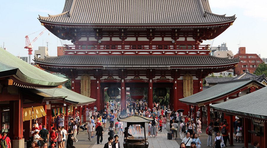 Best Japanese Temples to Visit: Top 6 Must-See Temples in Japan 8 Senso-ji Temple in Tokyo with the large red Kaminarimon gate and visitors walking along Nakamise Street