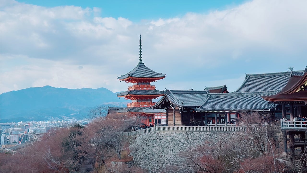 Kiyomizu-dera Temple in Kyoto overlooking the city, with its wooden hall and pagoda set against surrounding hills