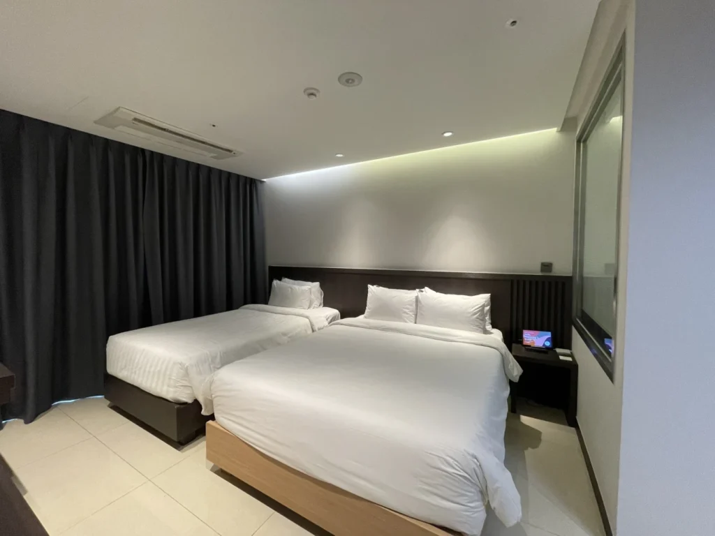 Union Hotel Seoul connecting room bedroom with twin and double beds