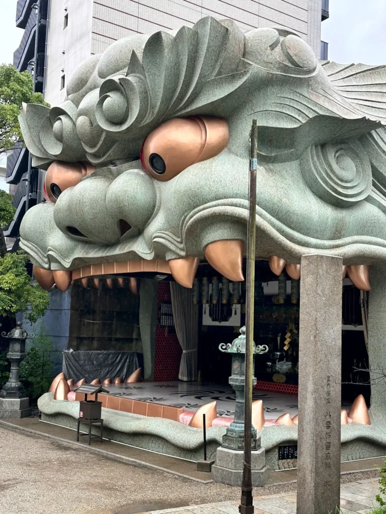 Side view of Namba Yasaka Shrine lion head stage Osaka detailed sculpture and structure