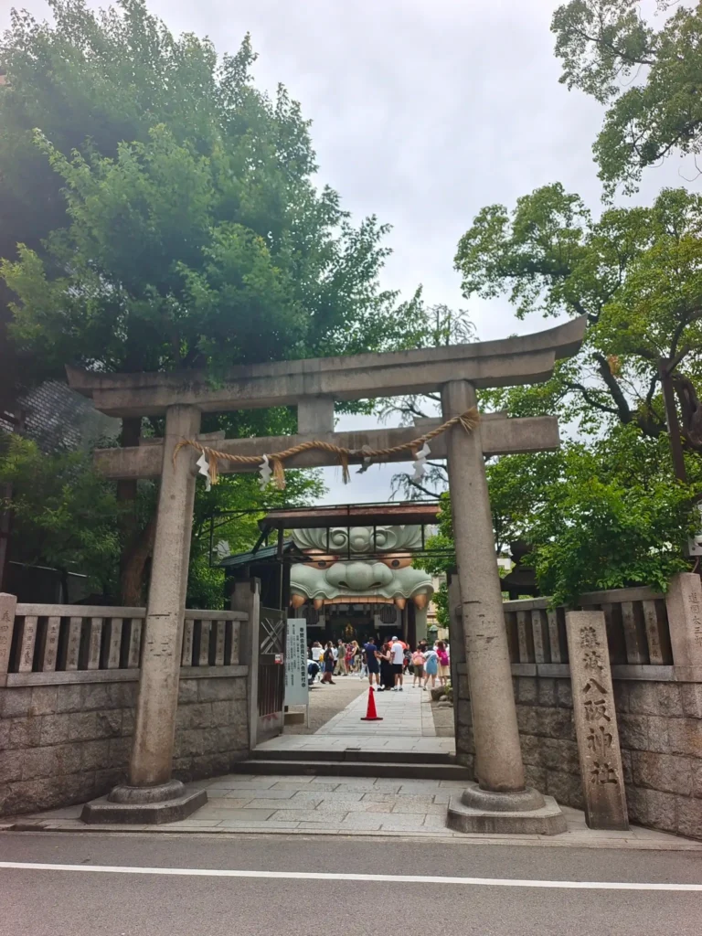 Torii gate entrance Namba Yasaka Shrine Osaka with lion head visible in background