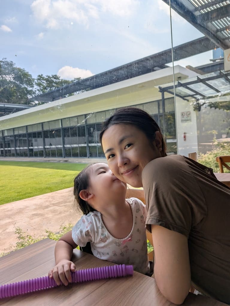 The Canopy HortPark Review: Family-Friendly Brunch 5 Toddler kissing mother during brunch at The Canopy HortPark Singapore