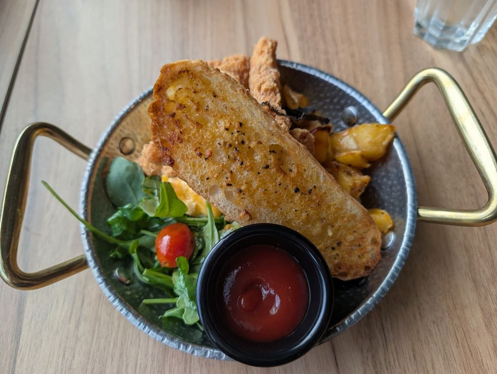 The Canopy HortPark Review: Family-Friendly Brunch 9 Brunch plate with grilled toast, chicken cutlet, scrambled eggs and salad at The Canopy HortPark