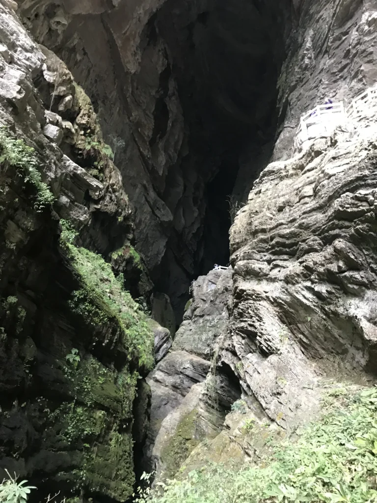 Towering limestone cliffs and sinkhole landscape at Three Natural Bridges in Wulong Karst National Park Chongqing