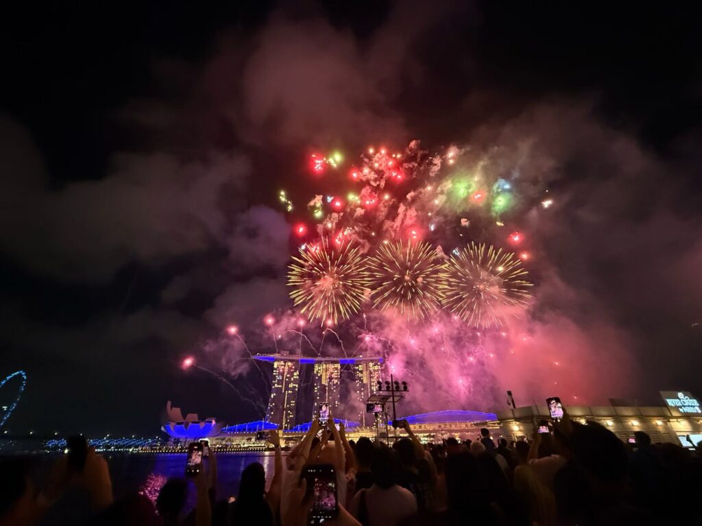 Disney Fireworks and Drone Show at Marina Bay Singapore (Family Experience Guide) 12 Crowds watching fireworks over Marina Bay Sands during Disney Cruise Line sky show Singapore
