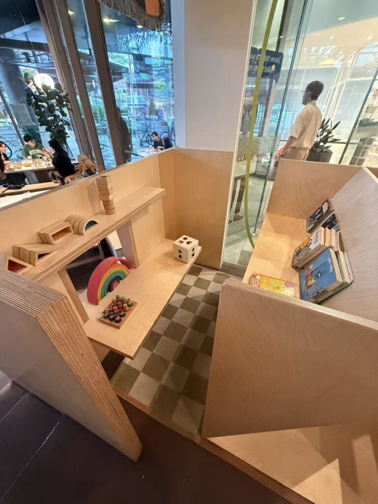 kids play corner at Yeast Side with wooden toys and books