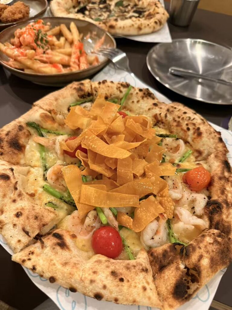 881 pizza with prawns pineapple sauce asparagus and crispy wonton topping