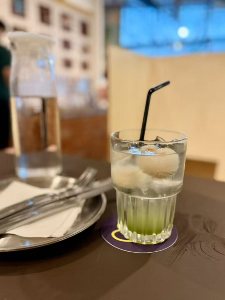 lychee pandan fizz drink served in glass at Yeast Side restaurant