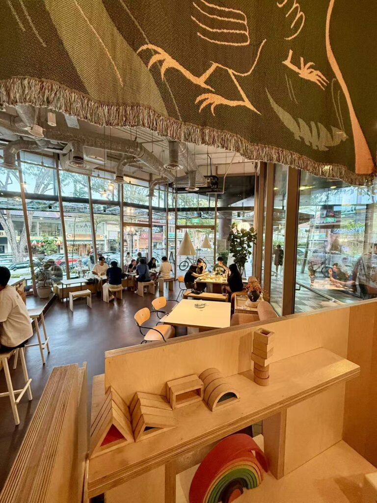 Yeast Side dining area with large windows and casual seating atmosphere