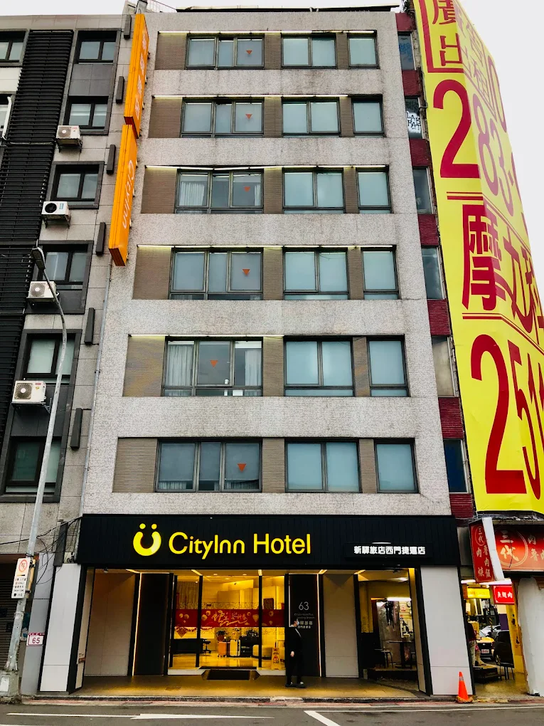 6 Best Muslim Friendly Hotels in Taipei (Halal Hotels Near Ximending & More) 9 City hotel exterior in Taipei with compact multi-story building and street-level entrance in a busy district