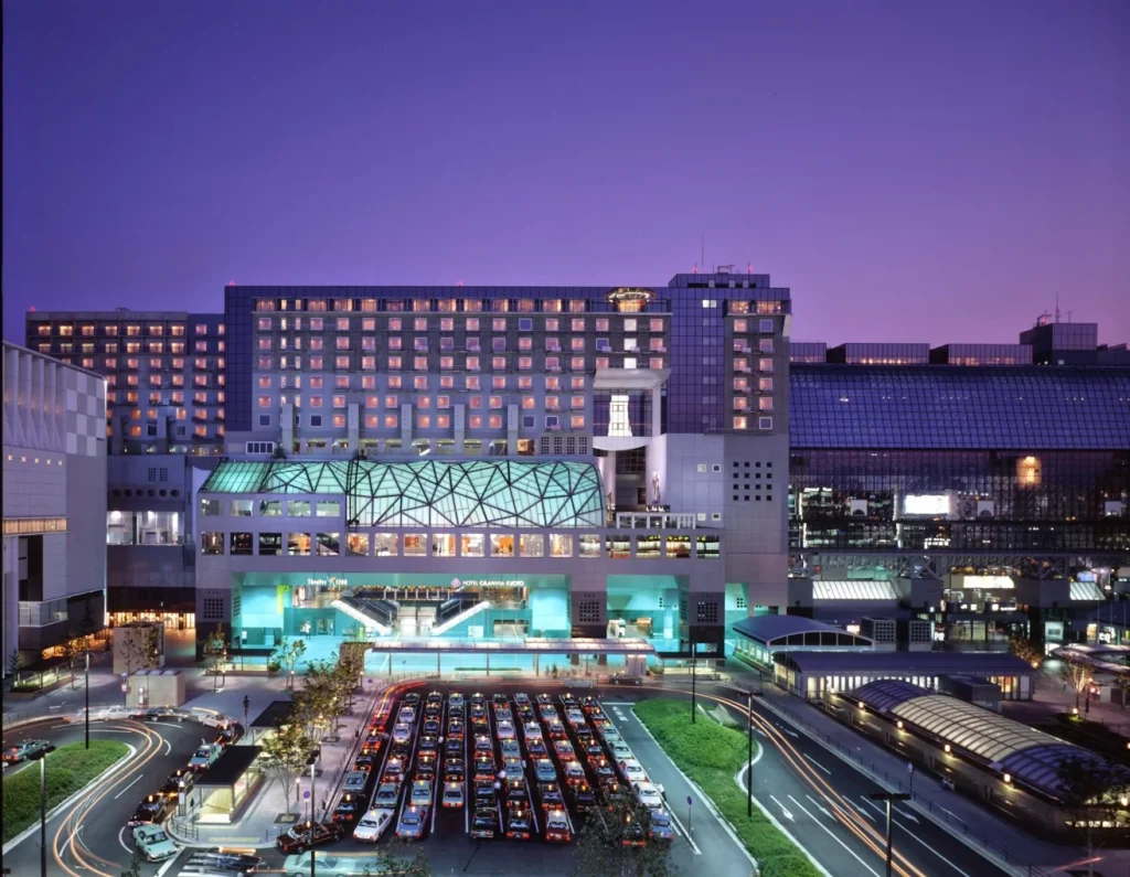 10 Best Muslim-Friendly Hotels (Halal) In Kyoto 5 Hotel Granvia Kyoto exterior at night connected to Kyoto Station with city lights and transport hub