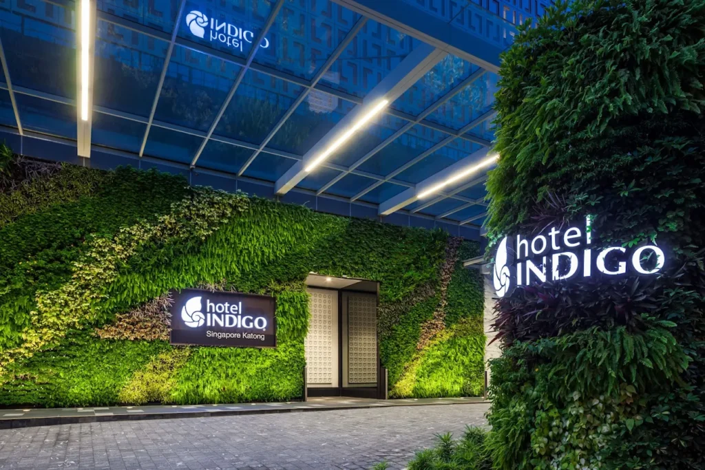 Hotel Indigo Singapore Katong entrance with vertical garden facade and modern boutique hotel design in Katong neighborhood