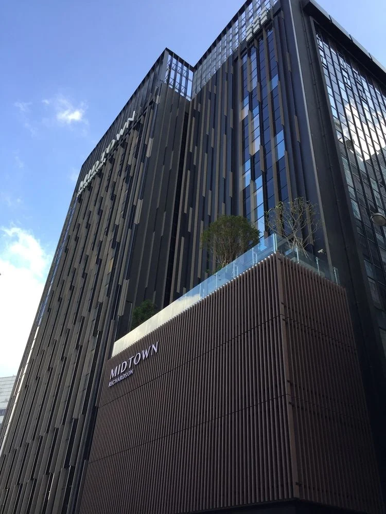 6 Best Muslim Friendly Hotels in Taipei (Halal Hotels Near Ximending & More) 7 Modern hotel building in Ximending Taipei with tall dark facade and contemporary architectural design