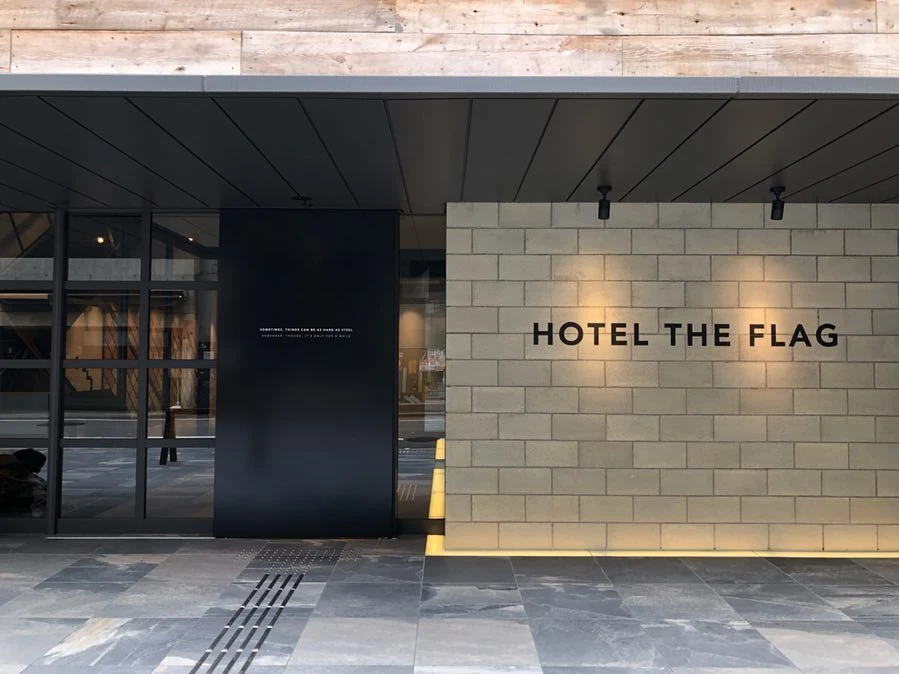 Hotel The Flag Shinsaibashi entrance with minimalist modern design in Osaka Japan