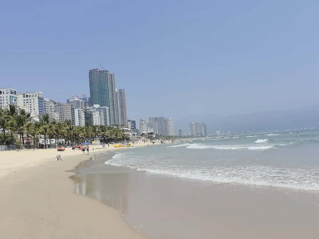 My Khe Beach Da Nang coastline with beachfront hotels and palm trees on a sunny day