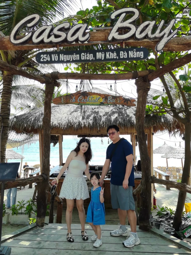 Family photo at Casa Bay beach bar My Khe Beach Da Nang Vietnam