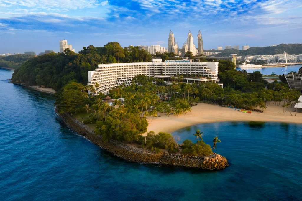 Shangri-La Rasa Sentosa beachfront resort in Singapore with private beach, tropical greenery, and family-friendly facilities