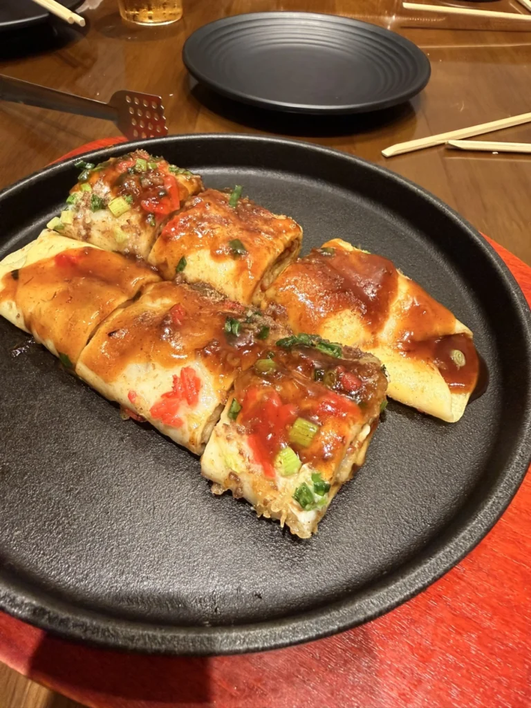 TEPPANIZAKAYA HIDEKI Da Nang Review: Authentic Osaka Teppanyaki Worth Trying 9 Tamagoyaki Osaka style pancake sliced and served at TEPPANIZAKAYA HIDEKI Da Nang