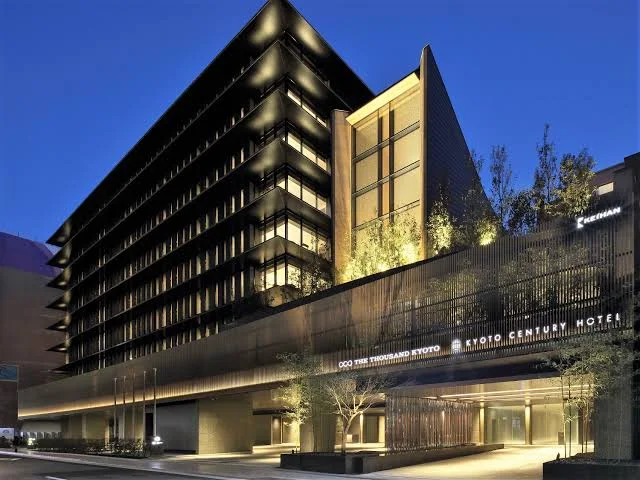 10 Best Muslim-Friendly Hotels (Halal) In Kyoto 6 THE THOUSAND KYOTO hotel exterior at night with modern architecture near Kyoto Station