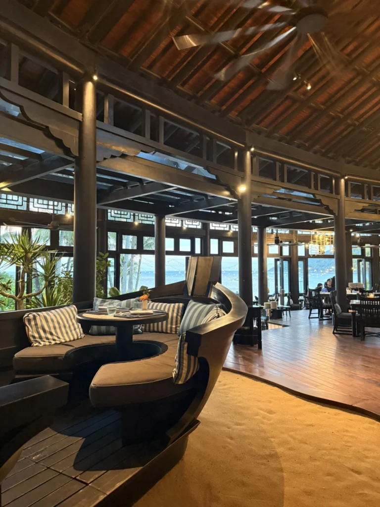 Terra Mare restaurant interior with cozy seating and ocean view at InterContinental Danang Sun Peninsula Resort
